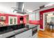 Modern kitchen features black countertops, stainless steel appliances, and sleek range hood at 19 Lullwater Ne Pl, Atlanta, GA 30307