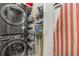 A laundry room featuring stacked washer and dryer with organizer on the wall at 19 Lullwater Ne Pl, Atlanta, GA 30307