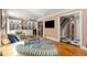 Comfortable living room featuring hardwood floors, built-in shelving, and an open doorway at 19 Lullwater Ne Pl, Atlanta, GA 30307