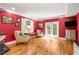 Bright living room with hardwood floors, French doors, and cozy seating area at 19 Lullwater Ne Pl, Atlanta, GA 30307