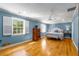 Bright main bedroom with plantation shutters, hardwood floors, and a ceiling fan at 19 Lullwater Ne Pl, Atlanta, GA 30307