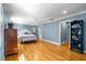 Spacious main bedroom with hardwood floors, ceiling fan, and ample natural light at 19 Lullwater Ne Pl, Atlanta, GA 30307