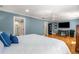 Large main bedroom featuring hardwood floors, a ceiling fan, and ensuite bathroom at 19 Lullwater Ne Pl, Atlanta, GA 30307