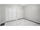 This bedroom features a large closet and nice tile floor at 613 Lone Oak Dr, Lithonia, GA 30058
