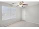 A carpeted bedroom has a window with window blinds, and a closet at 613 Lone Oak Dr, Lithonia, GA 30058