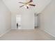 Spacious bedroom features vaulted ceiling, ceiling fan, carpet, and ensuite bath at 613 Lone Oak Dr, Lithonia, GA 30058