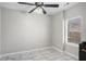 A dining area has a ceiling fan, tile floors, and a large window at 613 Lone Oak Dr, Lithonia, GA 30058