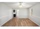 Bright dining room features new floors, chair rail, and ceiling fan with light fixture at 613 Lone Oak Dr, Lithonia, GA 30058