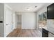 Eat-in kitchen with a view to the deck outside, stainless steel appliances and light colored walls at 613 Lone Oak Dr, Lithonia, GA 30058