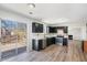 Modern kitchen with dark cabinetry, stainless steel appliances, and access to a wooden deck at 613 Lone Oak Dr, Lithonia, GA 30058