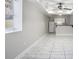 Living area with tile flooring, a ceiling fan, and a view to the kitchen at 613 Lone Oak Dr, Lithonia, GA 30058