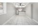 A spacious living area has tile flooring, and a ceiling fan at 613 Lone Oak Dr, Lithonia, GA 30058