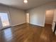 Bedroom with hardwood floors, neutral walls, walk-in closet and a door to a patio at 104 Stonehouse Dr, Cumming, GA 30040