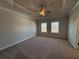 A large carpeted main bedroom with ceiling fan at 104 Stonehouse Dr, Cumming, GA 30040
