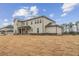 Spacious backyard featuring a two-story home with a covered patio at 267 Arwen Drive (Lot 66), Mcdonough, GA 30252
