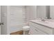Well-lit bathroom with a shower-tub combination, white vanity, and modern fixtures at 267 Arwen Drive (Lot 66), Mcdonough, GA 30252