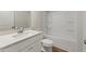 Bathroom featuring a shower-tub combo, toilet, vanity with mirror, and wood look floor at 267 Arwen Drive (Lot 66), Mcdonough, GA 30252
