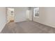 Bright bedroom with plush carpet, window with blinds and en-suite bathroom at 267 Arwen Drive (Lot 66), Mcdonough, GA 30252