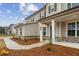 Welcoming front entrance with a covered porch and brick accents, offering a charming and inviting curb appeal at 267 Arwen Drive (Lot 66), Mcdonough, GA 30252