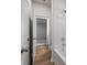 Hallway leading to bedroom with wood look floors and neutral walls at 267 Arwen Drive (Lot 66), Mcdonough, GA 30252