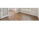 Open-concept living area showcasing beautiful hardwood floors and natural light, creating a warm and inviting atmosphere at 267 Arwen Drive (Lot 66), Mcdonough, GA 30252