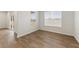 Bright living room boasts hardwood floors and natural light from two windows and a glass sliding door at 267 Arwen Drive (Lot 66), Mcdonough, GA 30252