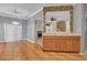 Bright dining area with hardwood floors, a modern chandelier, and a seamless transition into other living spaces at 267 Windy Cir, Mcdonough, GA 30253