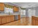 A well-lit kitchen features wooden cabinets, stainless steel appliances and stylish countertops at 267 Windy Cir, Mcdonough, GA 30253