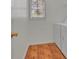 Functional laundry room with wood-look flooring, natural light, and modern appliances at 267 Windy Cir, Mcdonough, GA 30253