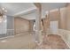 A cozy, open-concept living room features large windows, elegant wainscoting, and contemporary lighting at 267 Windy Cir, Mcdonough, GA 30253