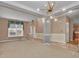 A cozy, open-concept living room features large windows, elegant wainscoting, and contemporary lighting at 267 Windy Cir, Mcdonough, GA 30253