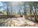 View of a spacious, shady backyard with a newly installed fence, perfect for outdoor activities at 3959 Emerald Springs Ct, Decatur, GA 30035