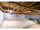Unfinished basement with concrete floor and cinder block walls, offering potential for customization and additional living space at 3959 Emerald Springs Ct, Decatur, GA 30035