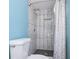 Updated bathroom showcases a tiled shower with a glass door and custom tile niche at 3959 Emerald Springs Ct, Decatur, GA 30035
