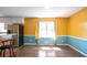 Dining room featuring bright walls, wood floors, and natural light at 3959 Emerald Springs Ct, Decatur, GA 30035
