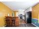 Bright kitchen with a breakfast bar, stainless steel appliances, and white cabinets at 3959 Emerald Springs Ct, Decatur, GA 30035