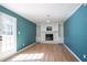 Inviting living room with fireplace and built-in shelves, bathed in natural light at 3959 Emerald Springs Ct, Decatur, GA 30035
