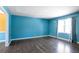 The living room offers hardwood floors, light blue walls, and natural light at 3959 Emerald Springs Ct, Decatur, GA 30035