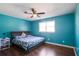 Well-lit bedroom featuring a comfortable bed, ceiling fan, and ample natural light at 3959 Emerald Springs Ct, Decatur, GA 30035