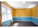 Well-lit room featuring a large window and two-tone walls at 3959 Emerald Springs Ct, Decatur, GA 30035