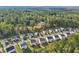 Areal view of a residential community with tree coverage and mountain views at 6235 Banyan Trl, Cumming, GA 30028