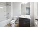 Well-lit bathroom with a shower-tub, modern vanity, and neutral finishes for a clean aesthetic at 6235 Banyan Trl, Cumming, GA 30028