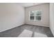 Bedroom with plush carpet and a large window providing lots of natural light at 6235 Banyan Trl, Cumming, GA 30028