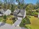 Charming two-story home featuring a well-manicured lawn, gray accents and an attached two-car garage at 6235 Banyan Trl, Cumming, GA 30028