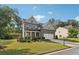 Attractive two-story home featuring a brick facade, a two-car garage, and a well-maintained front lawn at 6235 Banyan Trl, Cumming, GA 30028