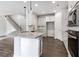 Gourmet kitchen features stainless steel appliances, granite countertops and hardwood floors at 6235 Banyan Trl, Cumming, GA 30028