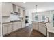 Gourmet kitchen features granite countertops, stainless steel appliances and hardwood floors at 6235 Banyan Trl, Cumming, GA 30028
