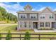 Charming townhome featuring stone accents, neutral siding, and well-maintained landscaping, creating a welcoming curb appeal at 6701 Cedar Glen Rd, Peachtree Corners, GA 30071