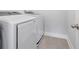 The laundry room features a side-by-side washer and dryer on a tiled floor at 6701 Cedar Glen Rd, Peachtree Corners, GA 30071