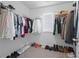 Walk-in closet with clothing racks, shelves, and shoe storage at 6701 Cedar Glen Rd, Peachtree Corners, GA 30071